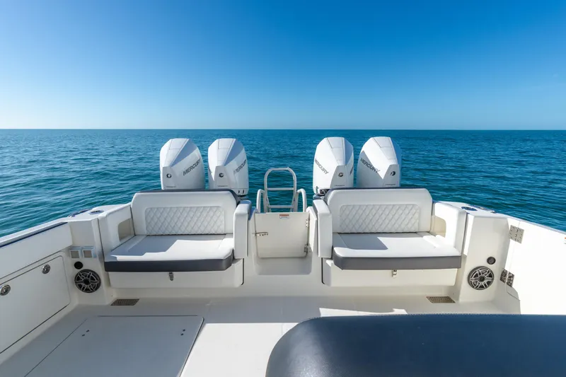  Yacht Photos Pics 2024 World Cat 400 DC-X boat with twin Mercury engines on open sea.