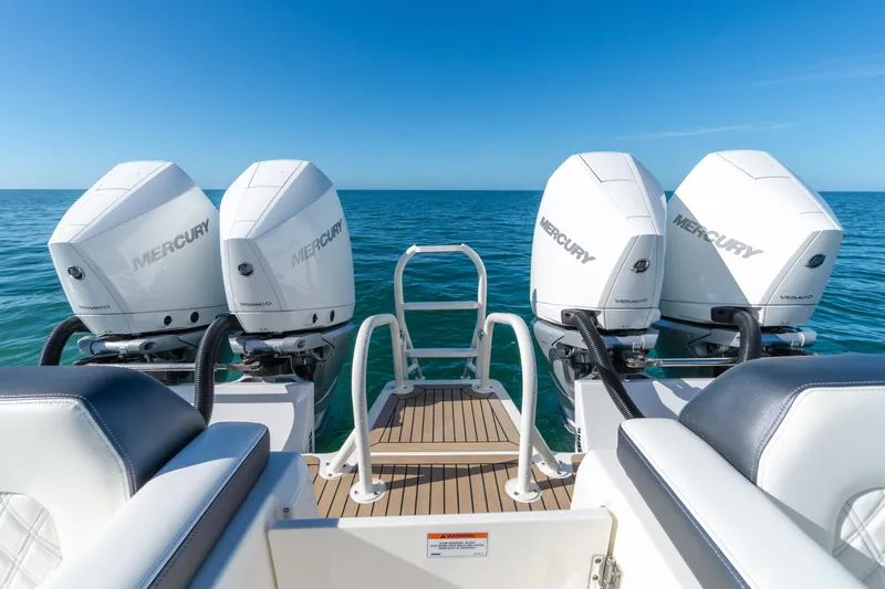  Yacht Photos Pics 2024 World Cat 400 DC-X boat with dual Mercury outboard engines on open sea.