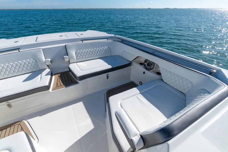  Yacht Photos Pics Luxurious seating on 2024 World Cat 400 DC-X boat, overlooking serene ocean waters.