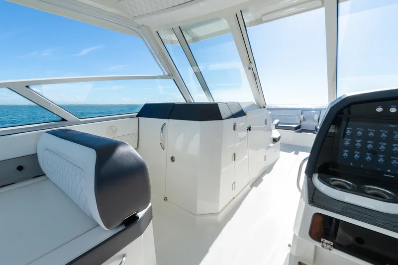  Yacht Photos Pics 2024 World Cat 400 DC-X interior with modern dashboard and ocean view.