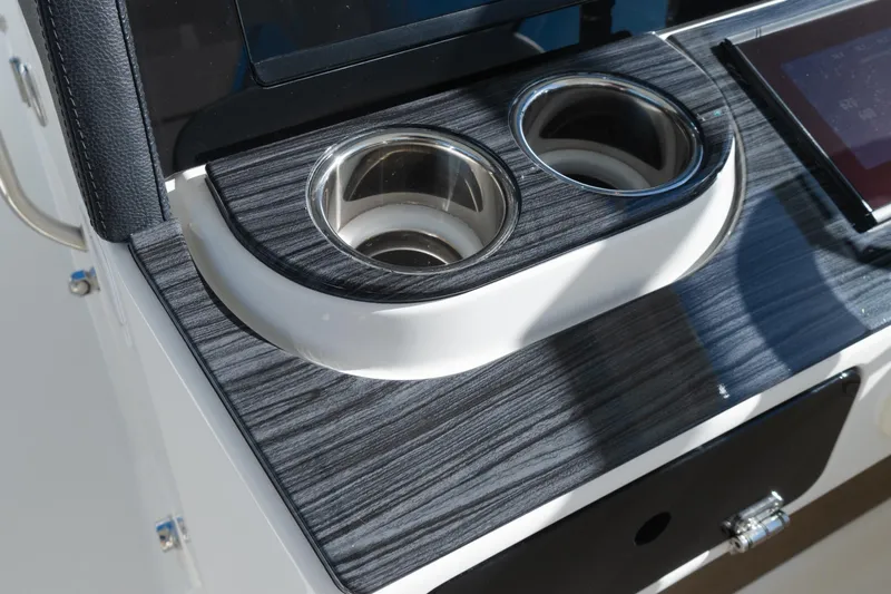  Yacht Photos Pics 2024 World Cat 400 DC-X boat interior with dual cup holders and sleek wood finish.