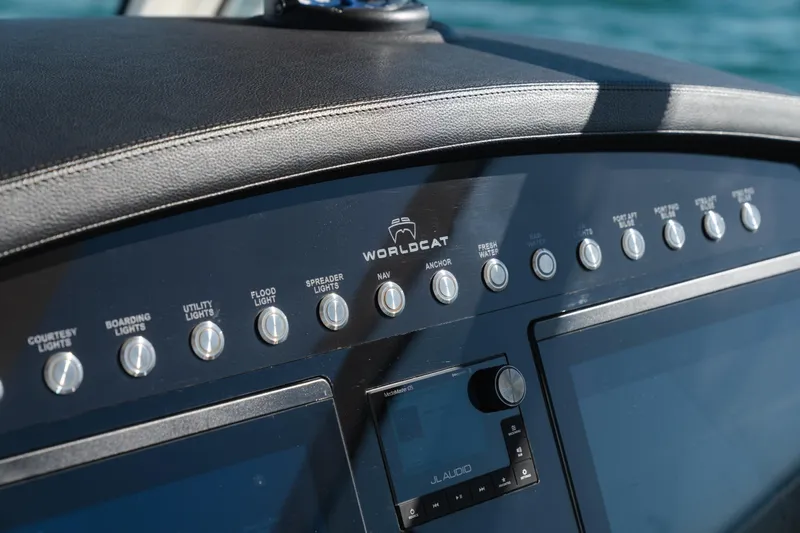  Yacht Photos Pics Control panel of 2024 World Cat 400 DC-X boat with various switches and displays.