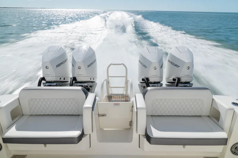  Yacht Photos Pics 2024 World Cat 400 DC-X boat with four Mercury engines cruising on open water.