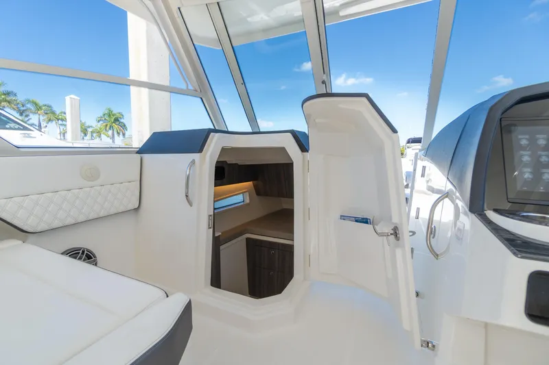  Yacht Photos Pics 2024 World Cat 400 DC-X interior cabin with open door, showcasing modern design.