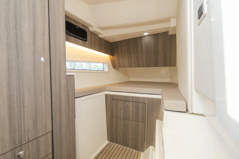  Yacht Photos Pics 2024 World Cat 400 DC-X cabin interior with modern wood finish and ample storage.