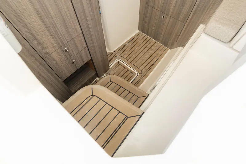  Yacht Photos Pics 2024 World Cat 400 DC-X interior with wood paneling and striped flooring.