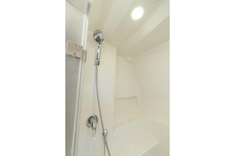  Yacht Photos Pics Shower area in 2024 World Cat 400 DC-X boat, featuring modern fixtures and lighting.