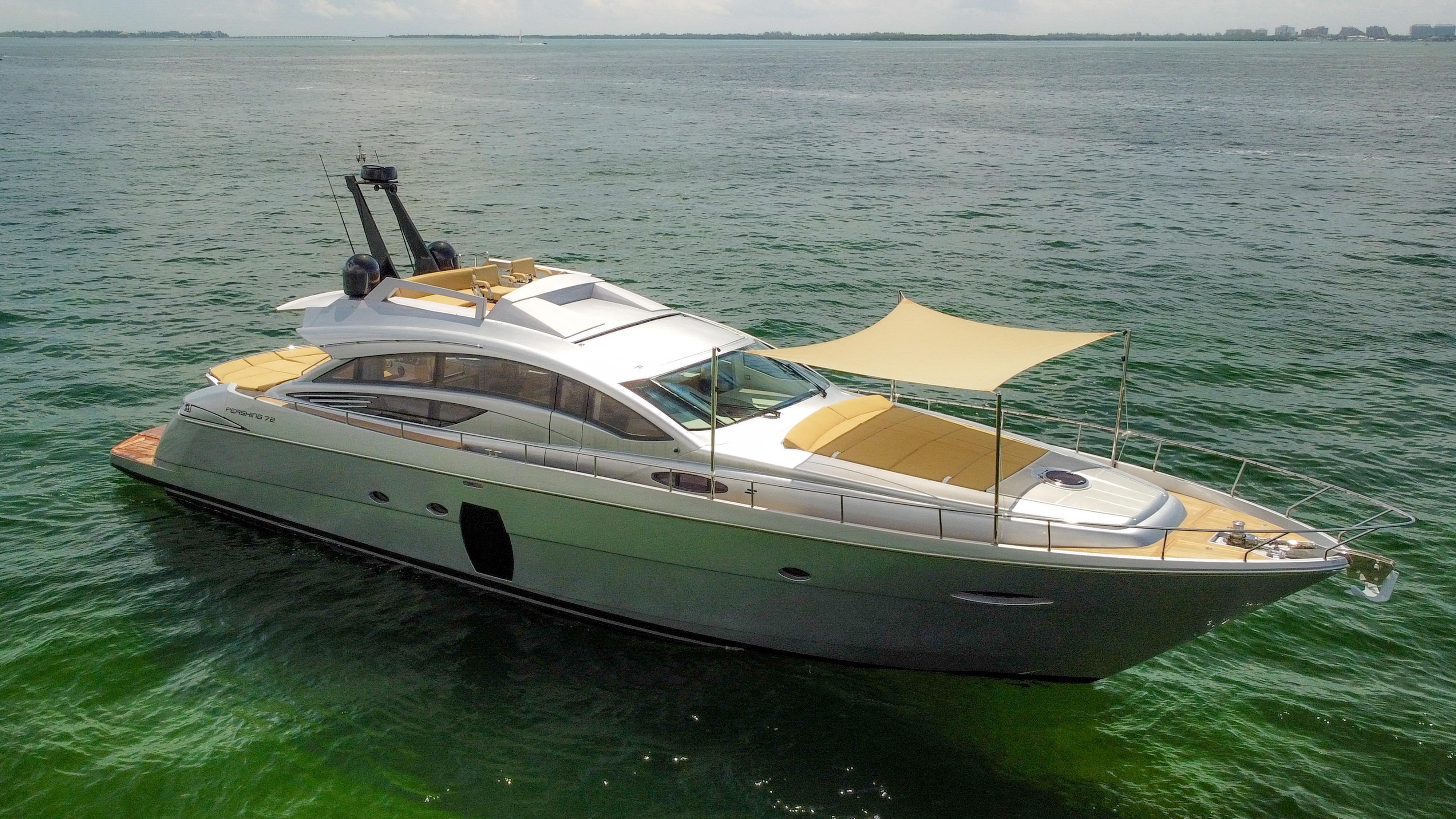 2009 Pershing 72 yacht on calm sea with sunshade canopy.