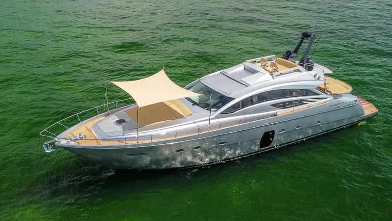  Yacht Photos Pics Luxurious 2009 Pershing 72 yacht cruising on vibrant green waters.