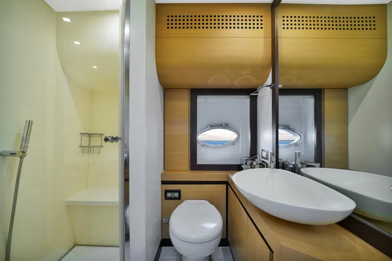  Yacht Photos Pics Luxurious bathroom in a 2009 Pershing 72 yacht, featuring modern fixtures and elegant design.