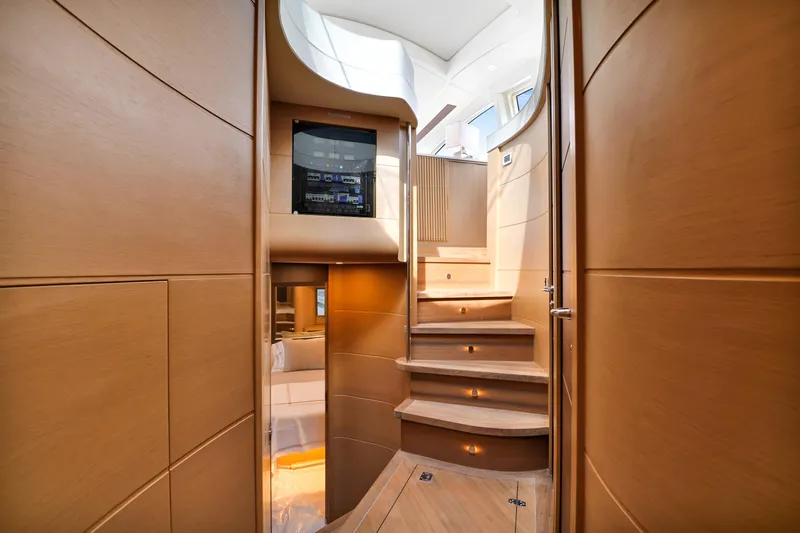  Yacht Photos Pics Luxurious interior of 2009 Pershing 72 yacht with wooden stairs and modern design.