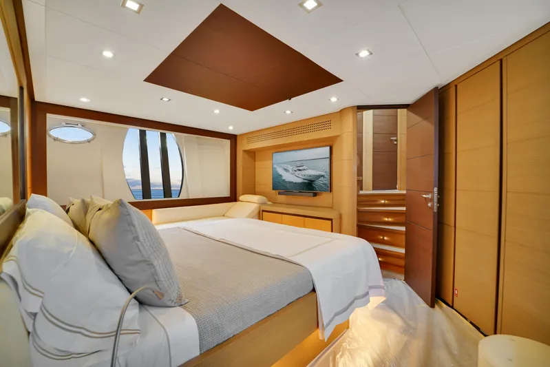  Yacht Photos Pics Luxurious bedroom interior of 2009 Pershing 72 yacht with modern design and ocean view.