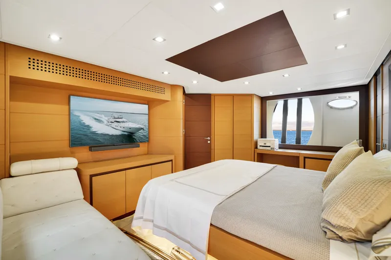  Yacht Photos Pics Luxurious bedroom interior of 2009 Pershing 72 yacht with modern decor and ocean view.