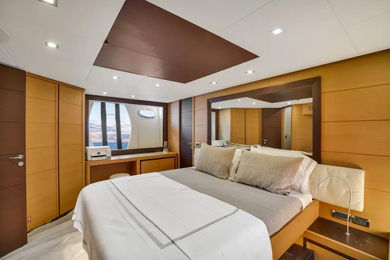  Yacht Photos Pics Luxurious bedroom interior of 2009 Pershing 72 yacht with modern design and elegant furnishings.