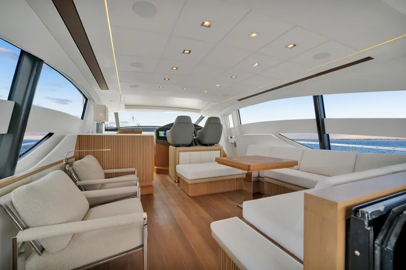  Yacht Photos Pics Luxurious interior of a 2009 Pershing 72 yacht with modern seating and panoramic windows.