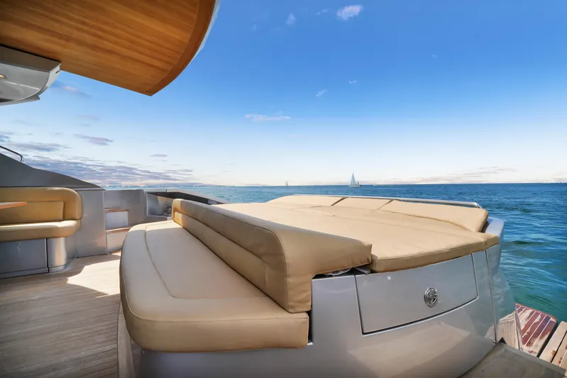  Yacht Photos Pics Luxurious 2009 Pershing 72 yacht deck with sun loungers and ocean view.