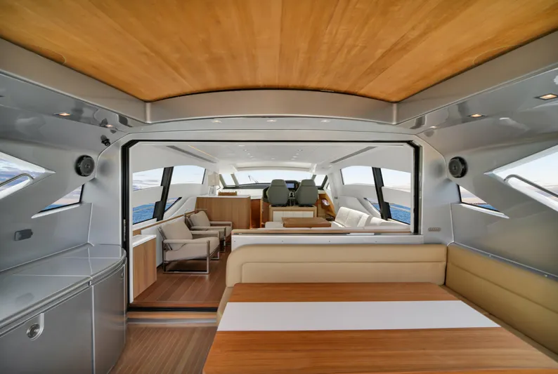  Yacht Photos Pics Luxurious interior of a 2009 Pershing 72 yacht with modern seating and wooden accents.