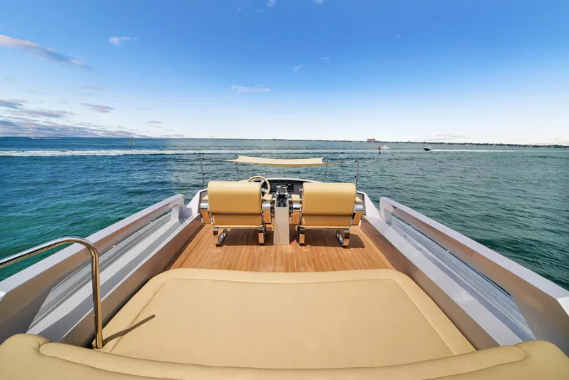  Yacht Photos Pics Luxury Pershing 72 yacht deck with ocean view, 2009 model, featuring elegant seating.