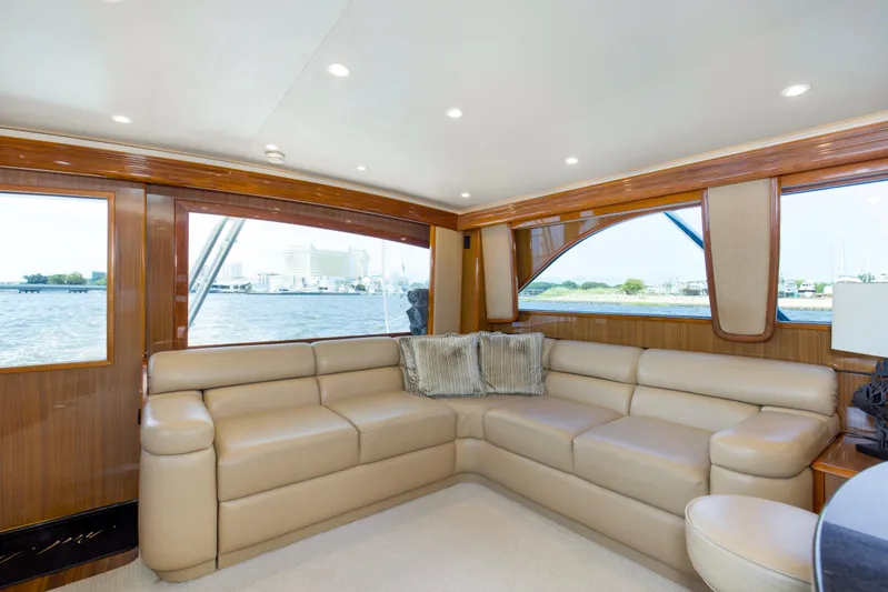 Reel Blues Yacht Photos Pics Luxurious interior of 2007 Viking 64 Enclosed Bridge yacht with leather seating and scenic windows.