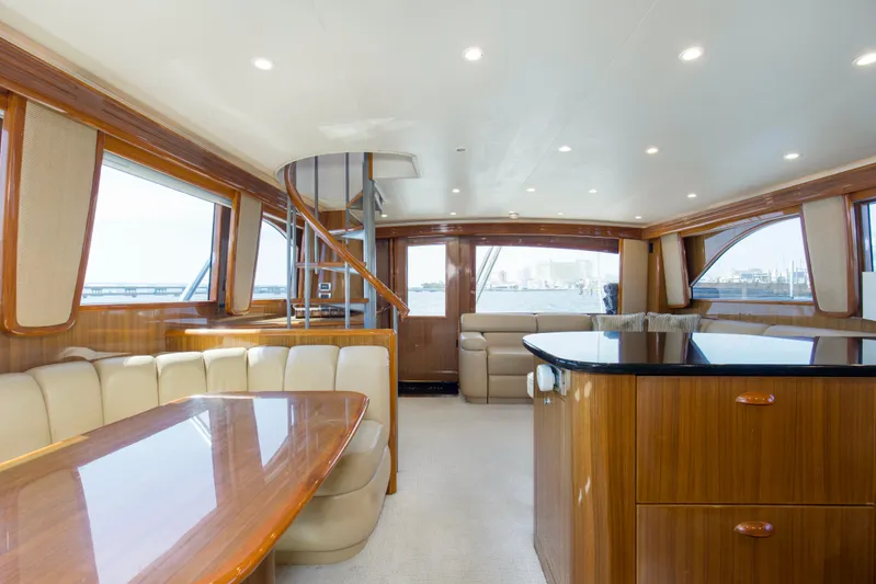 Reel Blues Yacht Photos Pics Luxurious interior of 2007 Viking 64 Enclosed Bridge yacht with elegant wood finishes.