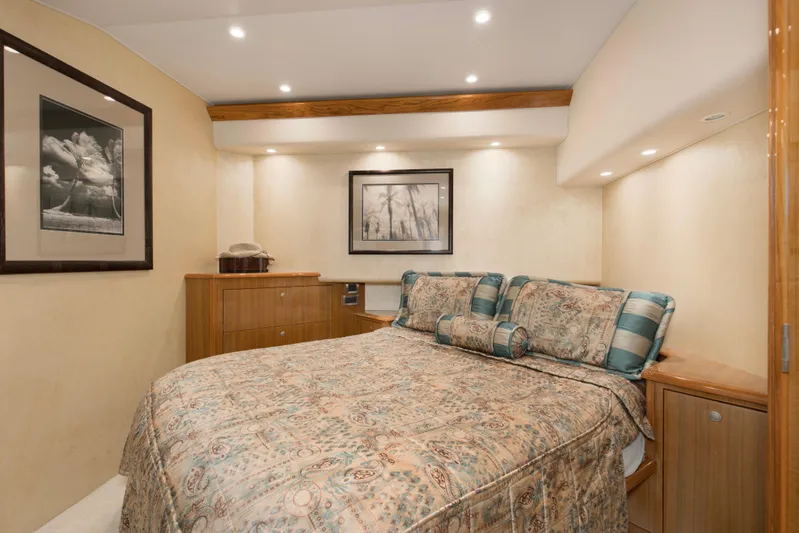 Reel Blues Yacht Photos Pics Luxurious bedroom interior of 2007 Viking 64 Enclosed Bridge yacht with elegant decor.