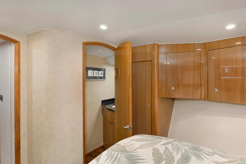 Reel Blues Yacht Photos Pics Interior of 2007 Viking 64 Enclosed Bridge yacht with wood cabinetry and modern design.
