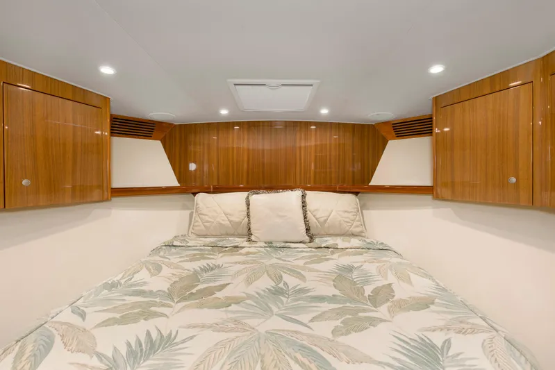 Reel Blues Yacht Photos Pics Luxurious cabin interior of 2007 Viking 64 Enclosed Bridge yacht with wood paneling.