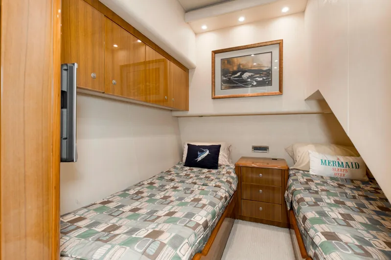 Reel Blues Yacht Photos Pics Cozy twin cabin in 2007 Viking 64 Enclosed Bridge yacht with wood accents and nautical decor.