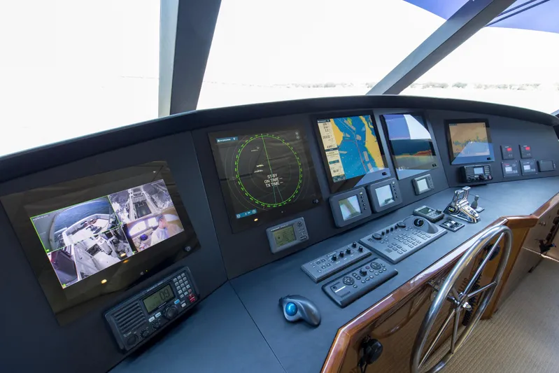 Reel Blues Yacht Photos Pics Control panel of 2007 Viking 64 Enclosed Bridge yacht with navigation screens and instruments.