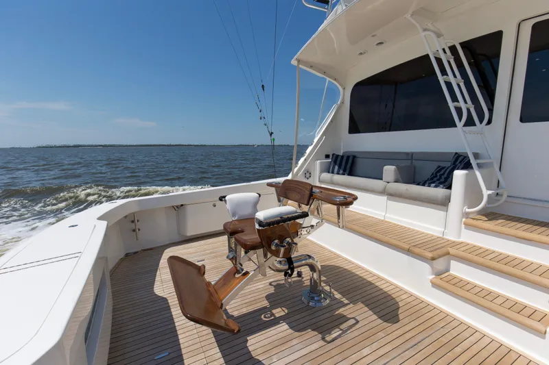 Reel Blues Yacht Photos Pics 2007 Viking 64 Enclosed Bridge yacht deck with seating and fishing chair.