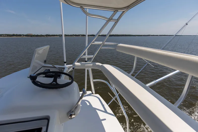 Reel Blues Yacht Photos Pics 2007 Viking 64 Enclosed Bridge yacht helm with ocean view.