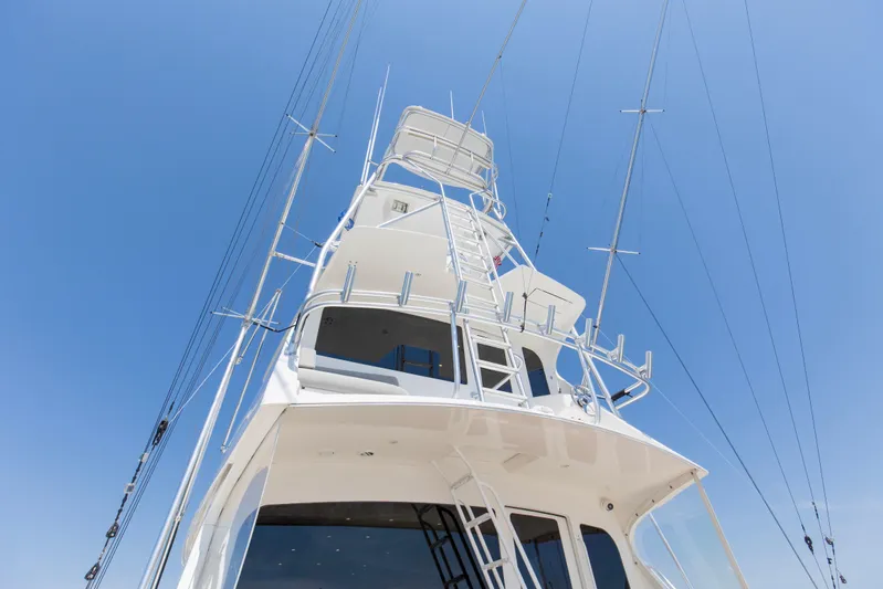 Reel Blues Yacht Photos Pics 2007 Viking 64 Enclosed Bridge yacht tower against clear blue sky.