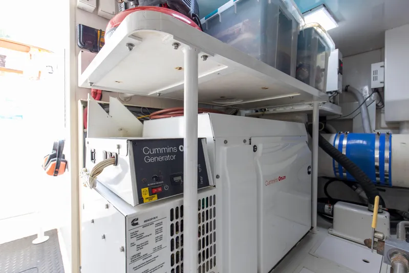 Reel Blues Yacht Photos Pics Engine room of 2007 Viking 64 Enclosed Bridge with Cummins Onan generator.