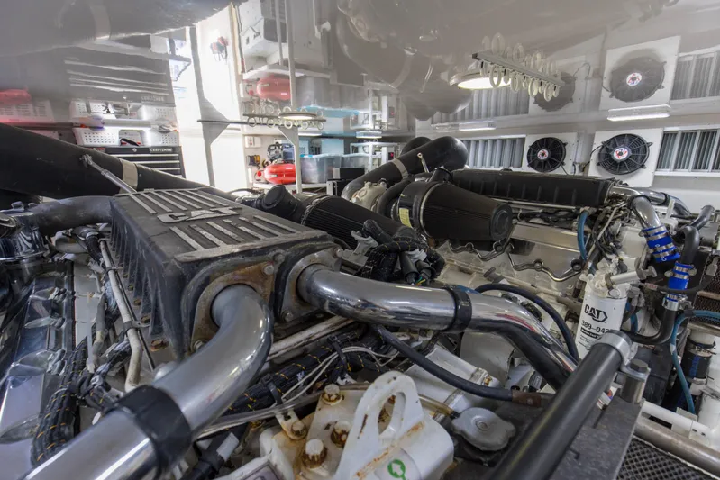Reel Blues Yacht Photos Pics Engine room of 2007 Viking 64 Enclosed Bridge yacht with CAT machinery.