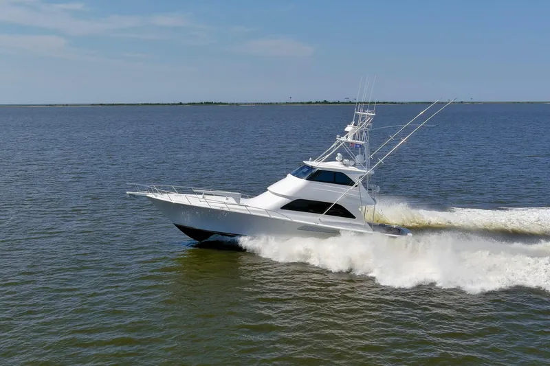 Reel Blues Yacht Photos Pics 2007 Viking 64 Enclosed Bridge yacht cruising on open water.