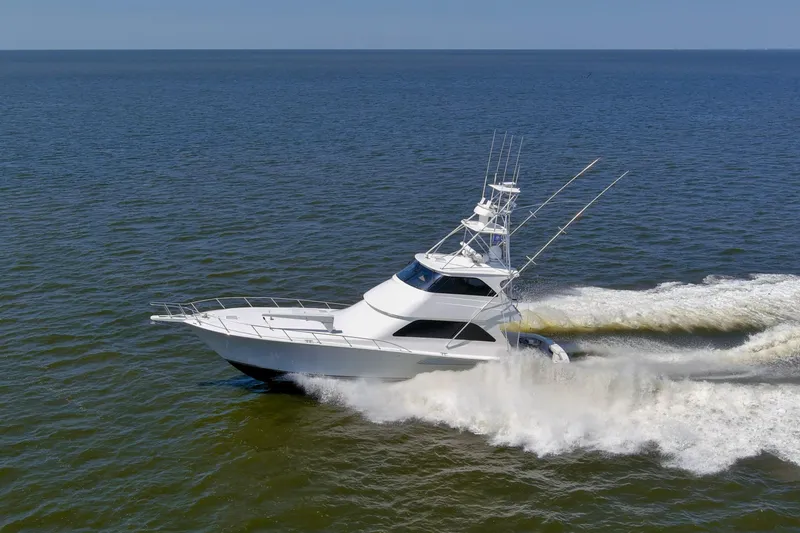 Reel Blues Yacht Photos Pics 2007 Viking 64 Enclosed Bridge yacht cruising on open water.