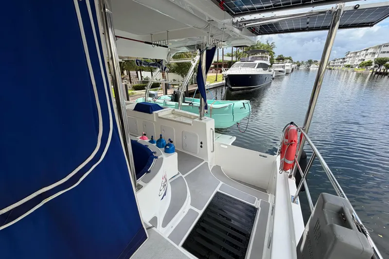 Calacoto Yacht Photos Pics 2023 Royal Cape Catamarans Majestic 530 docked, featuring spacious deck and modern amenities.