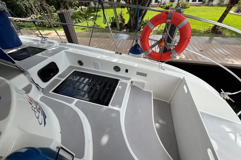 Calacoto Yacht Photos Pics 2023 Royal Cape Catamarans Majestic 530 deck with safety ring and dock view.