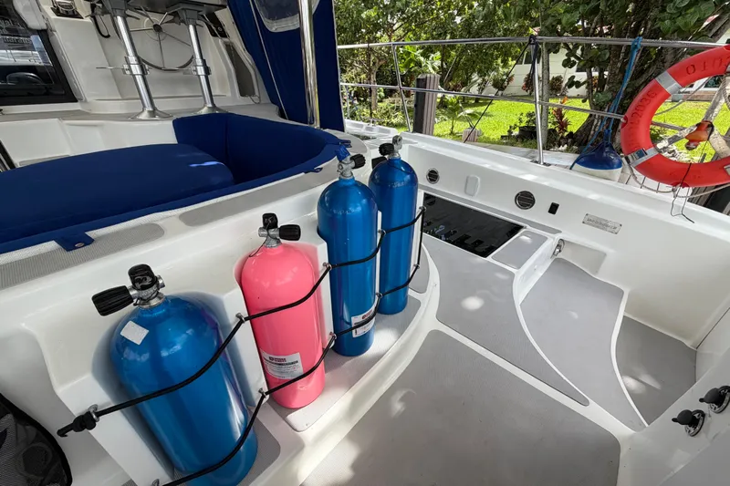 Calacoto Yacht Photos Pics 2023 Royal Cape Catamarans Majestic 530 deck with scuba tanks and safety equipment.