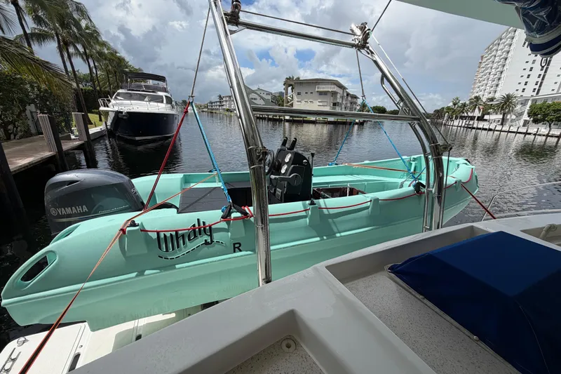 Calacoto Yacht Photos Pics Catamaran Majestic 530 with Whaly boat and Yamaha engine docked by waterfront.