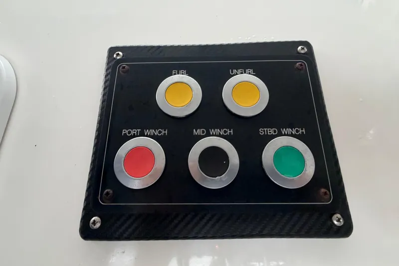 Calacoto Yacht Photos Pics Control panel on 2023 Royal Cape Catamarans Majestic 530 with winch and sail buttons.