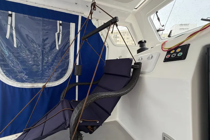 Calacoto Yacht Photos Pics Hammock chair on 2023 Royal Cape Catamarans Majestic 530, featuring blue and white interior.
