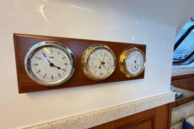 Calacoto Yacht Photos Pics Wall-mounted nautical instruments on 2023 Royal Cape Catamarans Majestic 530 yacht interior.
