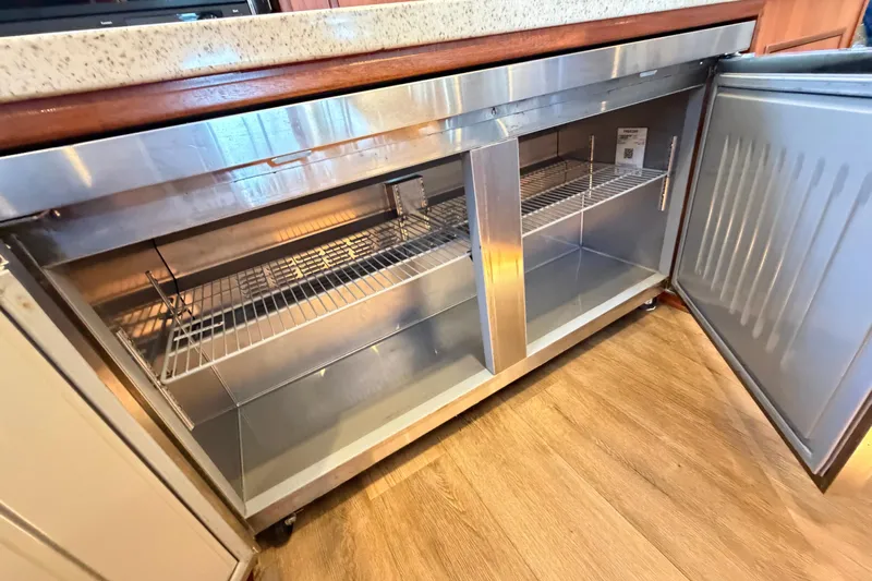 Calacoto Yacht Photos Pics Stainless steel refrigerator in 2023 Royal Cape Catamarans Majestic 530 yacht kitchen.