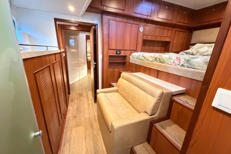 Calacoto Yacht Photos Pics Luxurious interior of 2023 Royal Cape Catamarans Majestic 530 with wood finishes and cozy seating.