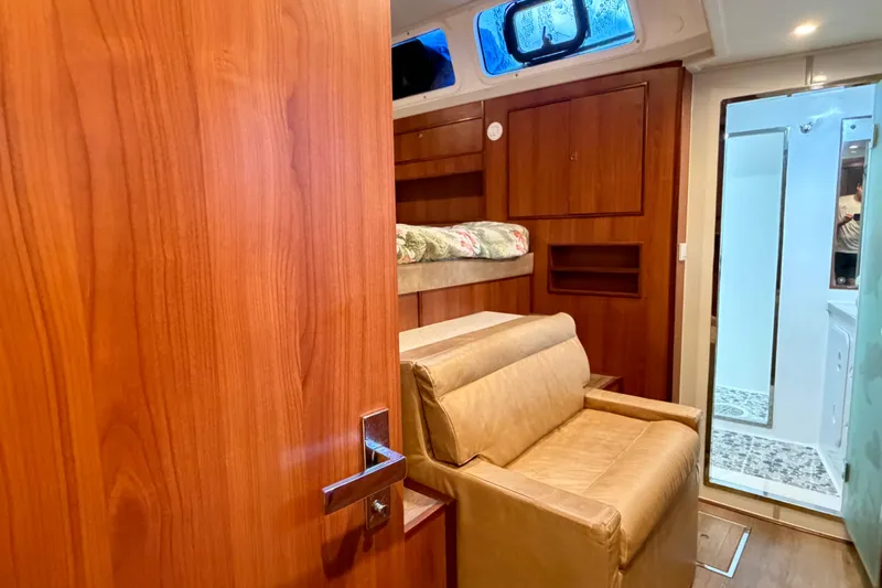 Calacoto Yacht Photos Pics Luxurious interior of 2023 Royal Cape Catamarans Majestic 530 with wood finish and cozy seating.