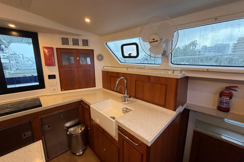 Calacoto Yacht Photos Pics Interior of 2023 Royal Cape Catamarans Majestic 530 kitchen with modern amenities.