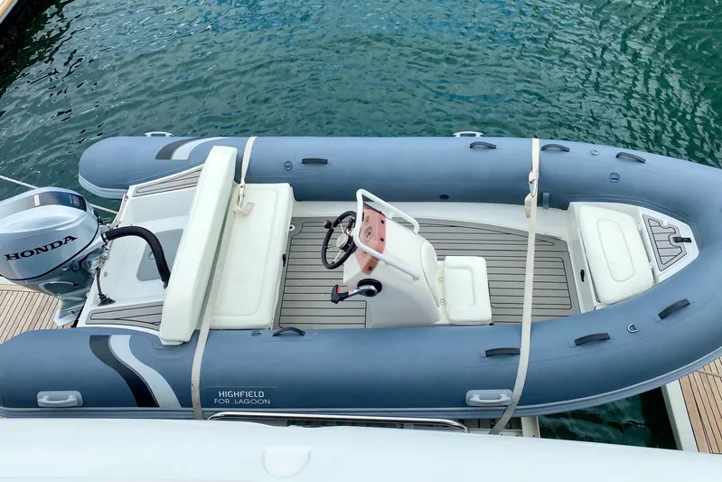  Yacht Photos Pics Inflatable boat docked beside a 2017 Lagoon 630 Motor Yacht.