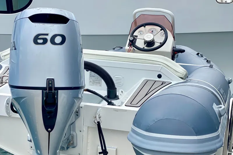  Yacht Photos Pics Outboard motor and steering console on a 2017 Lagoon 630 Motor Yacht.