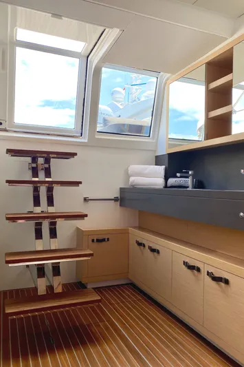  Yacht Photos Pics Interior of 2017 Lagoon 630 Motor Yacht with wooden steps and cabinetry.